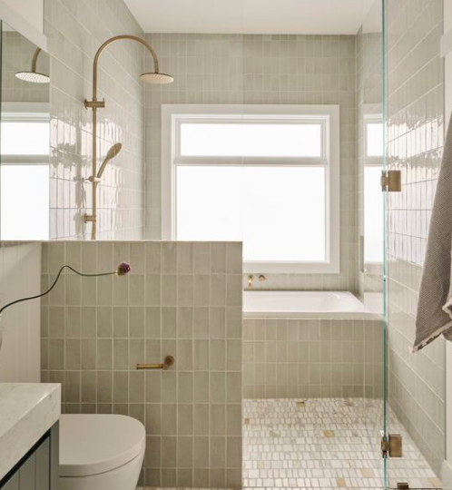 Spa-inspired bathroom with handmade sage zellige tile, open walk-in shower, soaking tub, and brass fixtures — beautiful and functional bathroom renovation