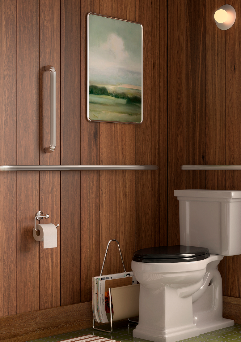 Rich walnut-paneled powder room with sculptural white toilet, polished chrome fixtures, and curated wall art — timeless bathroom design with thoughtful safety details